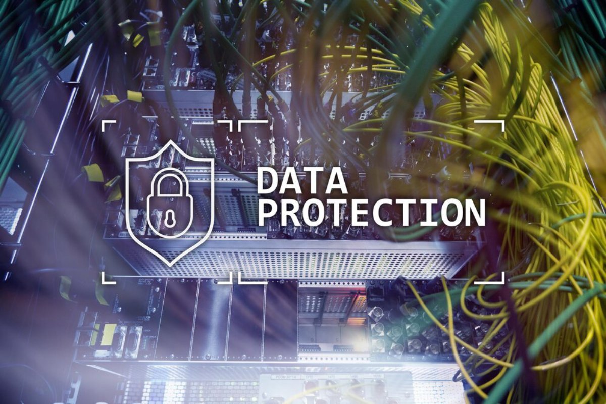 A close-up of server hardware surrounded by tangled wires, featuring a shield icon and the words DATA PROTECTION.