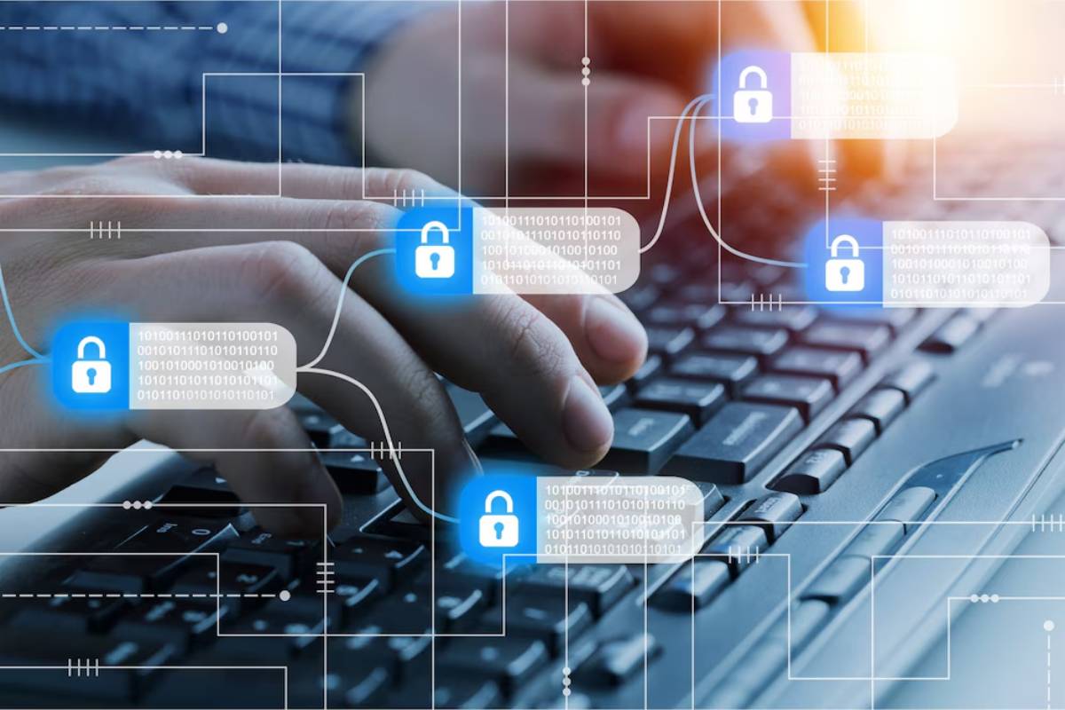 A Man doing hands typing on a keyboard with digital graphics of padlocks and binary code overlays, symbolizing data encryption