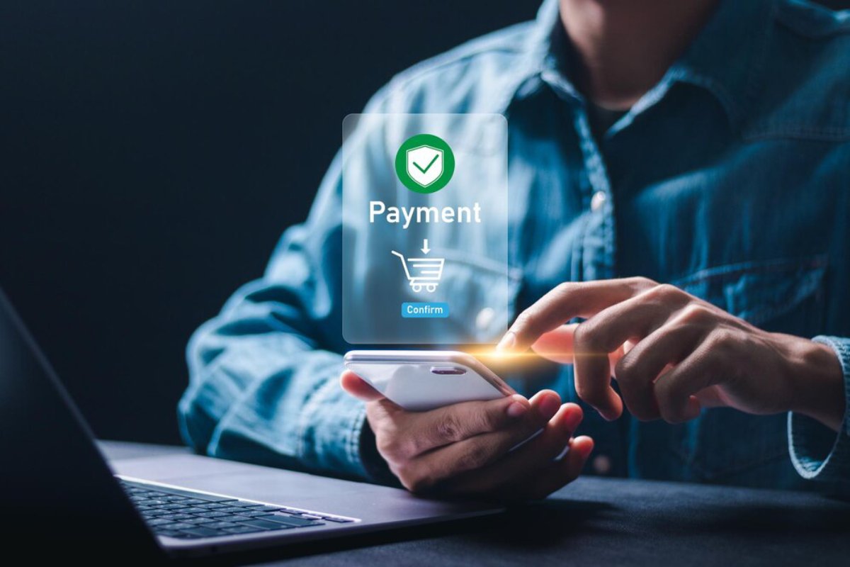 A person making a mobile payment, with a graphic overlay that shows 