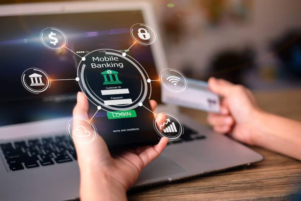 A person accessing a mobile banking app on their smartphone while holding a credit card, with digital banking icons in the background.