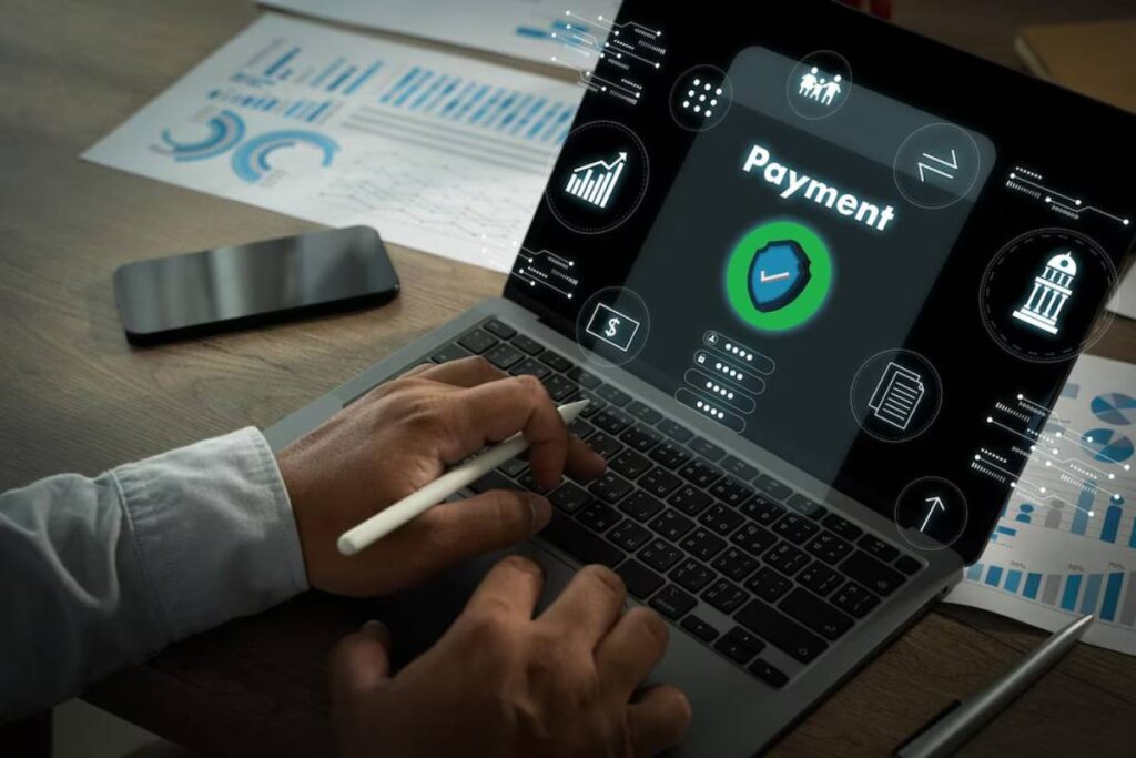 A person using a laptop with a focus on a Payment feature, surrounded by financial icons and data analytics graphics.